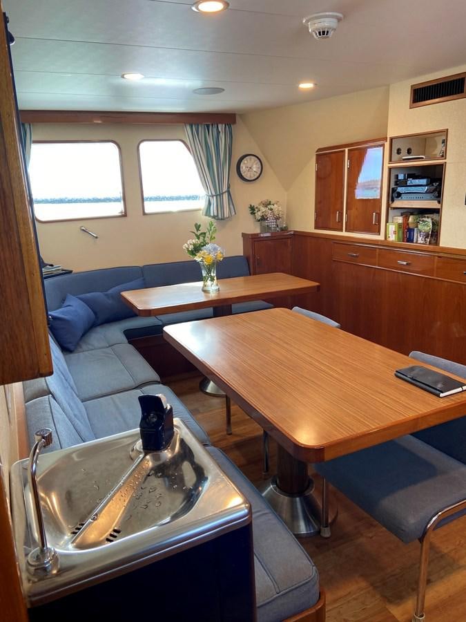 a kitchen and living room area aboard BUCKPASSER Yacht for Sale