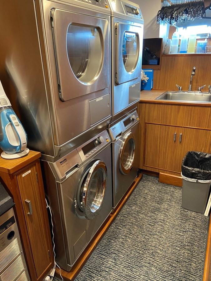 a kitchen with stainless steel appliances aboard BUCKPASSER Yacht for Sale