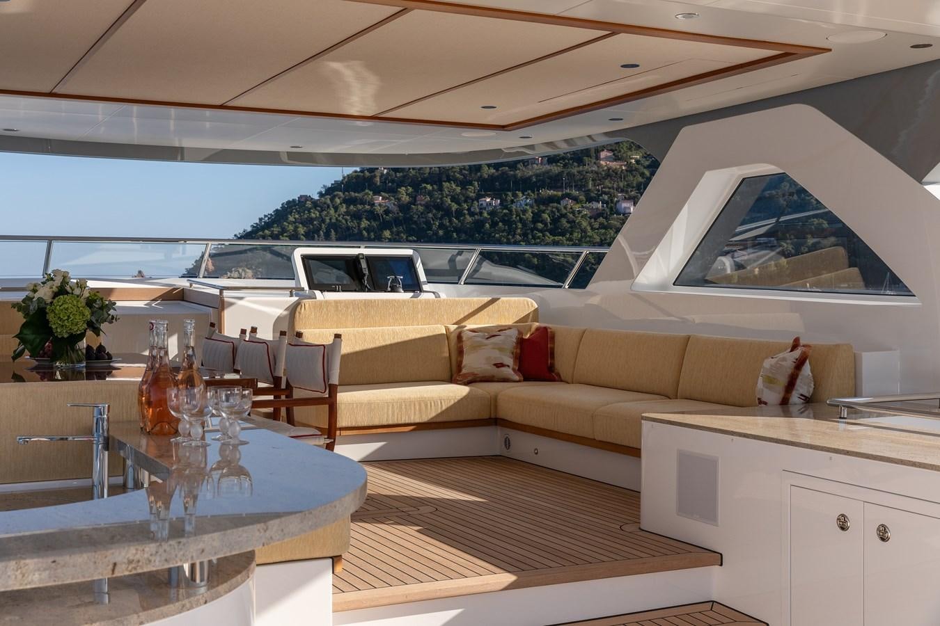 a living room with a large patio aboard SEAFLOWER Yacht for Sale