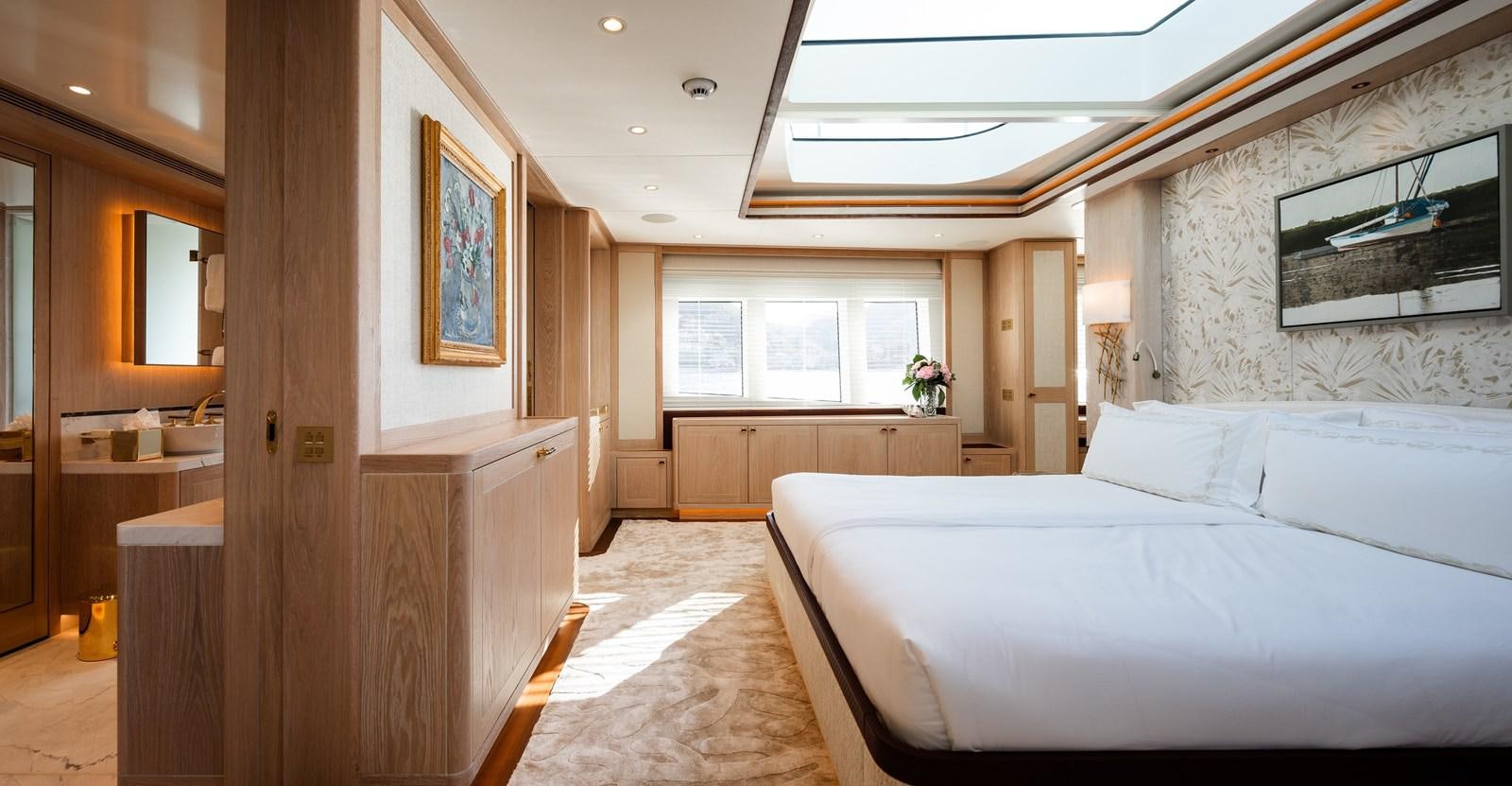 a room with a bed and a desk aboard SEAFLOWER Yacht for Sale