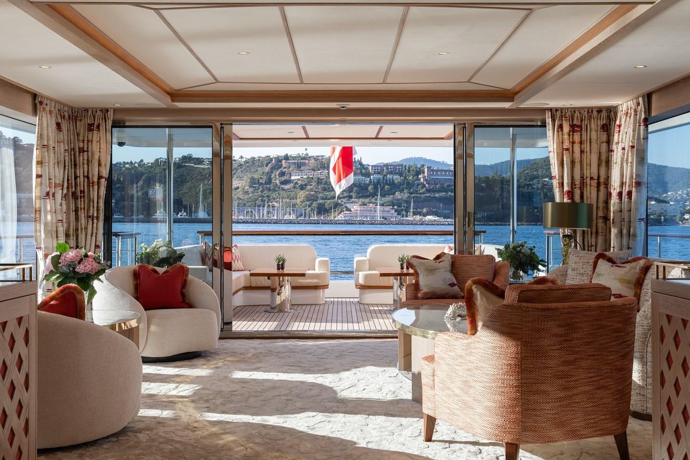 a living room with a large window aboard SEAFLOWER Yacht for Sale