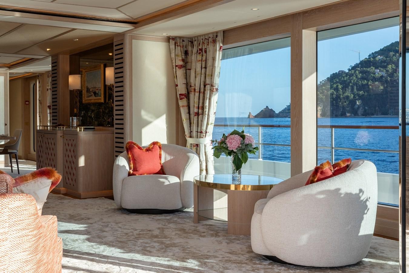 a living room with a large window aboard SEAFLOWER Yacht for Sale