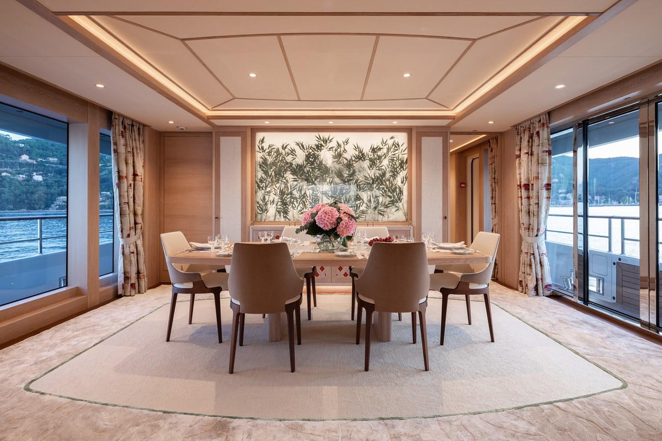 a large dining table in a room aboard SEAFLOWER Yacht for Sale