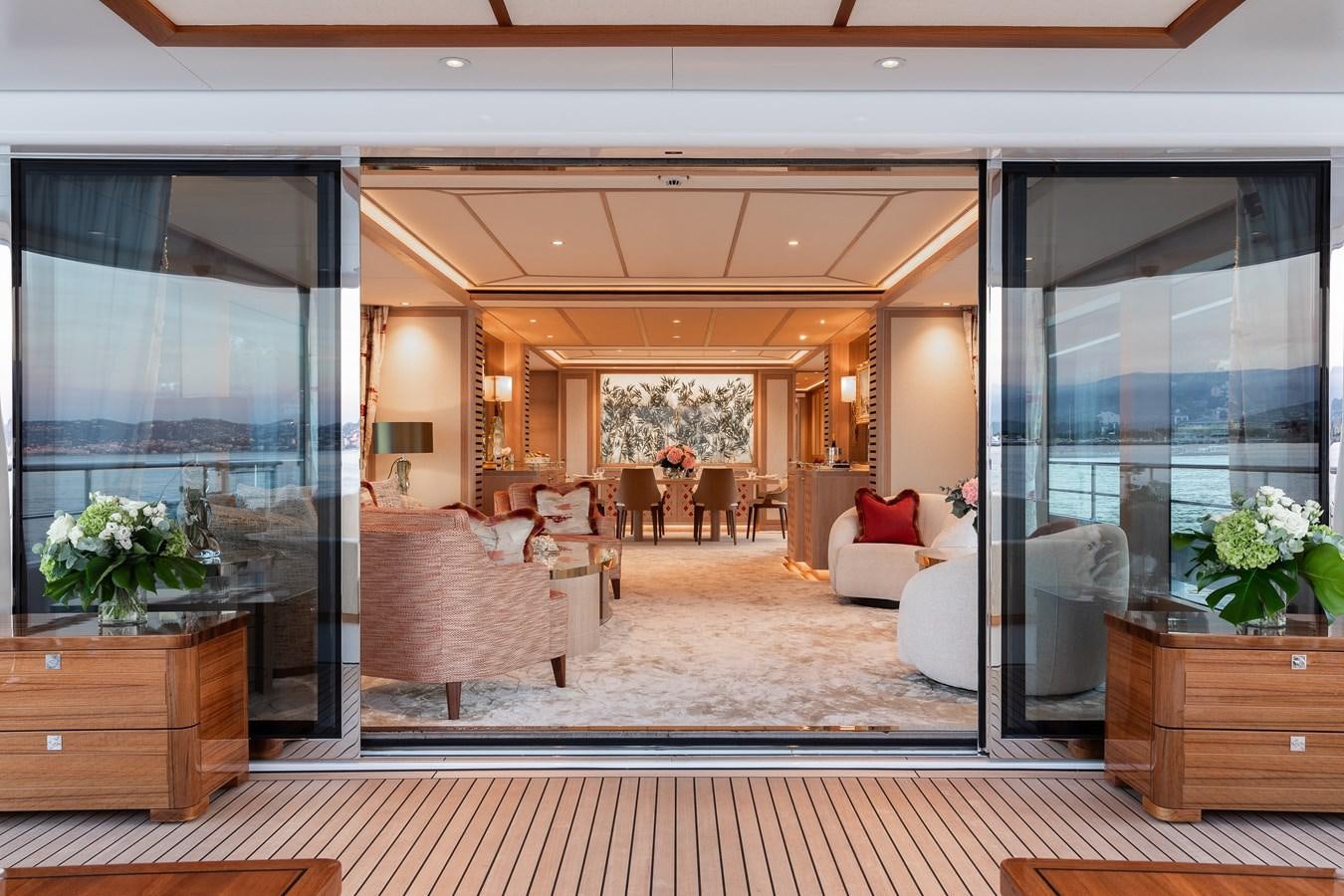 a living room with a large window aboard SEAFLOWER Yacht for Sale