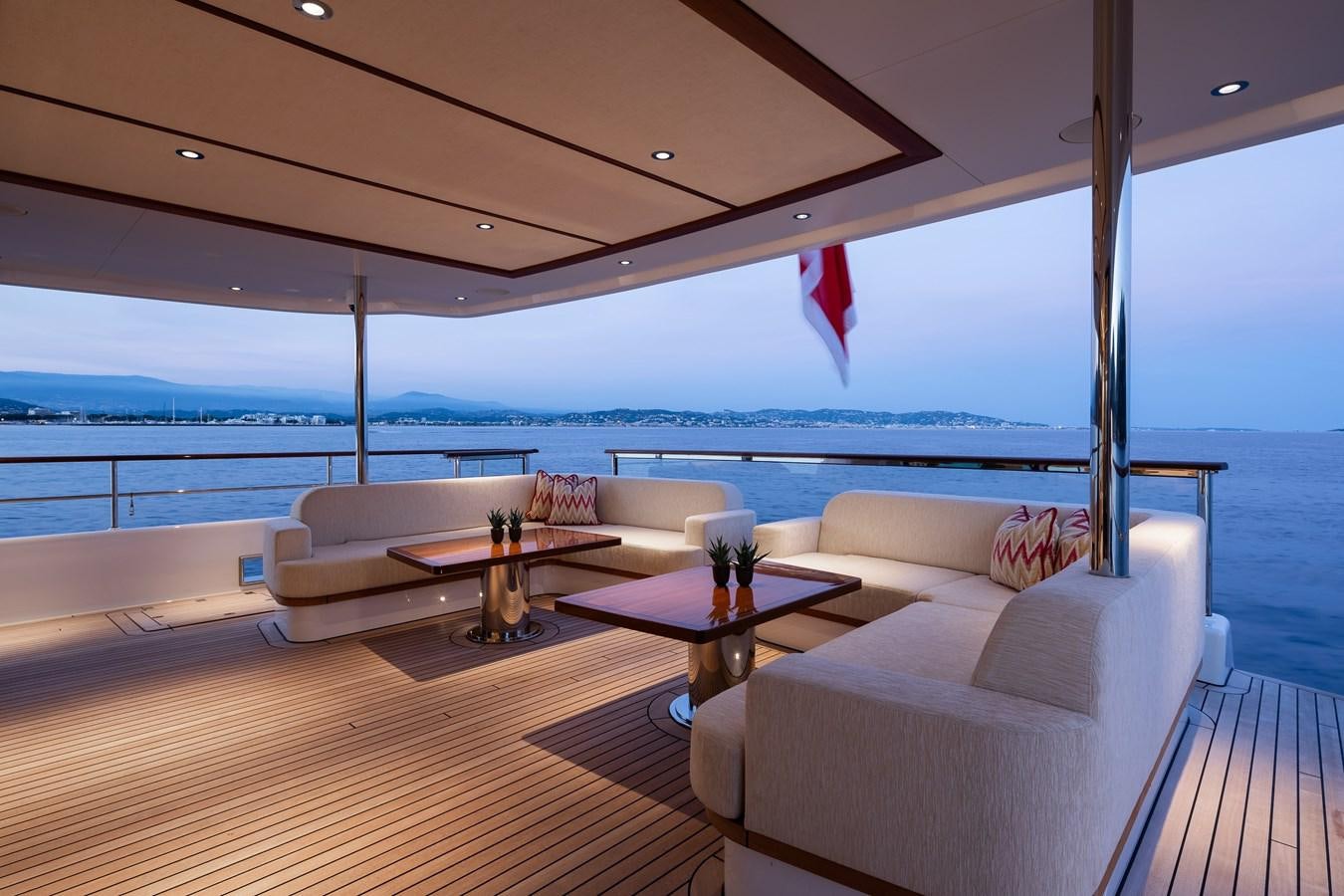 a living room with a table and chairs aboard SEAFLOWER Yacht for Sale