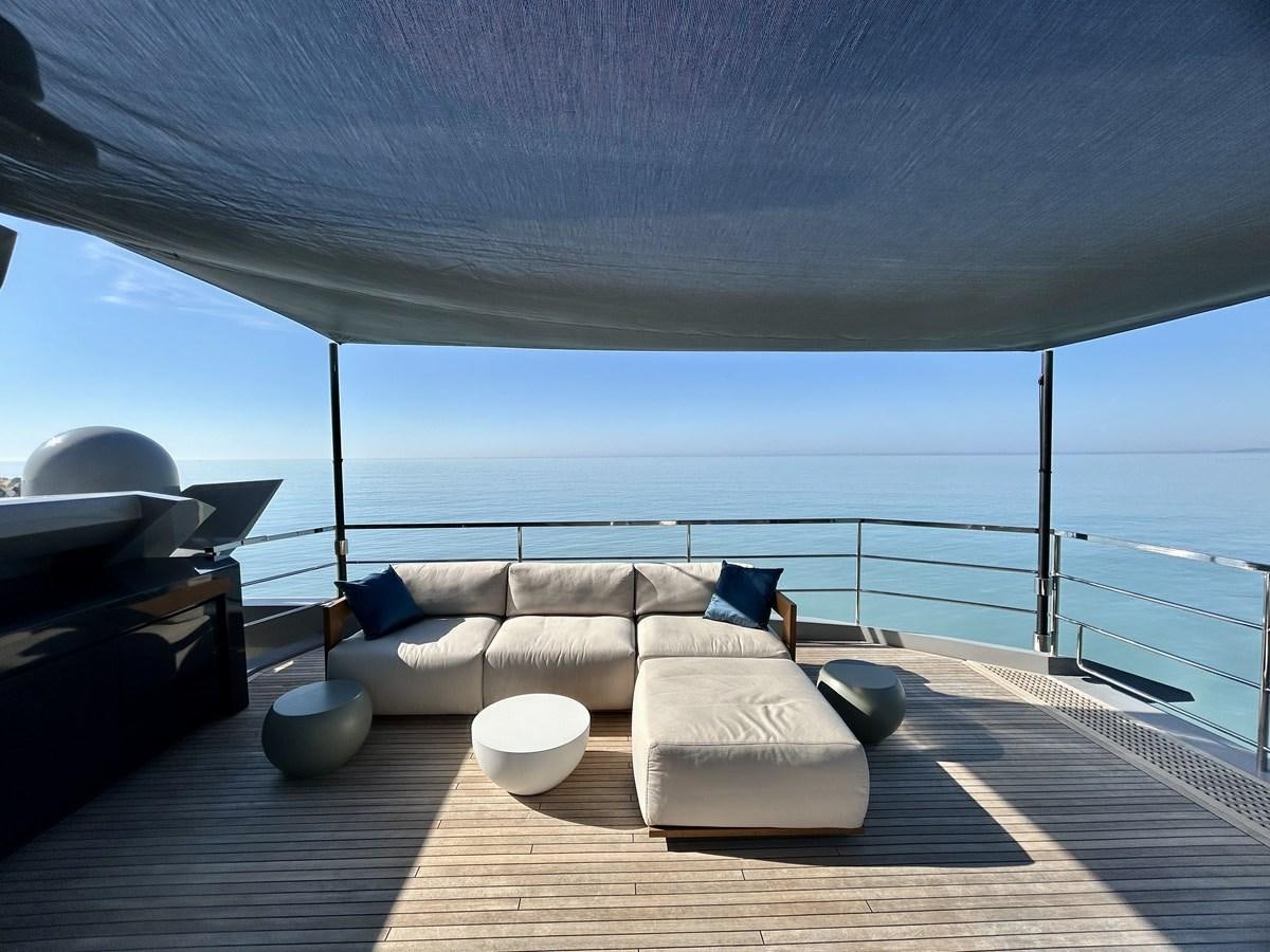 a living room with a large balcony aboard SHERPA 80 Yacht for Sale