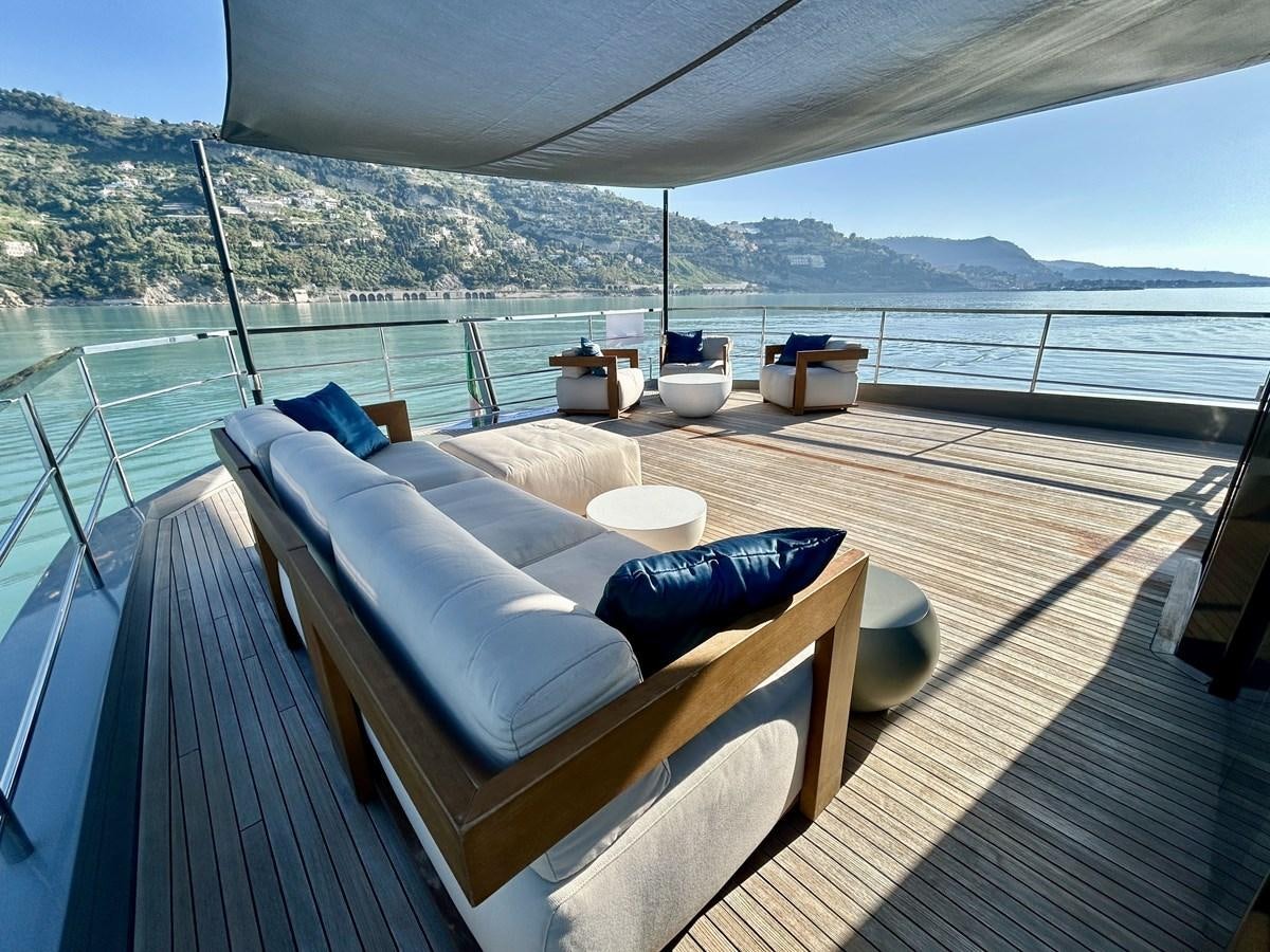 a deck with a view of the ocean and mountains aboard SHERPA 80 Yacht for Sale