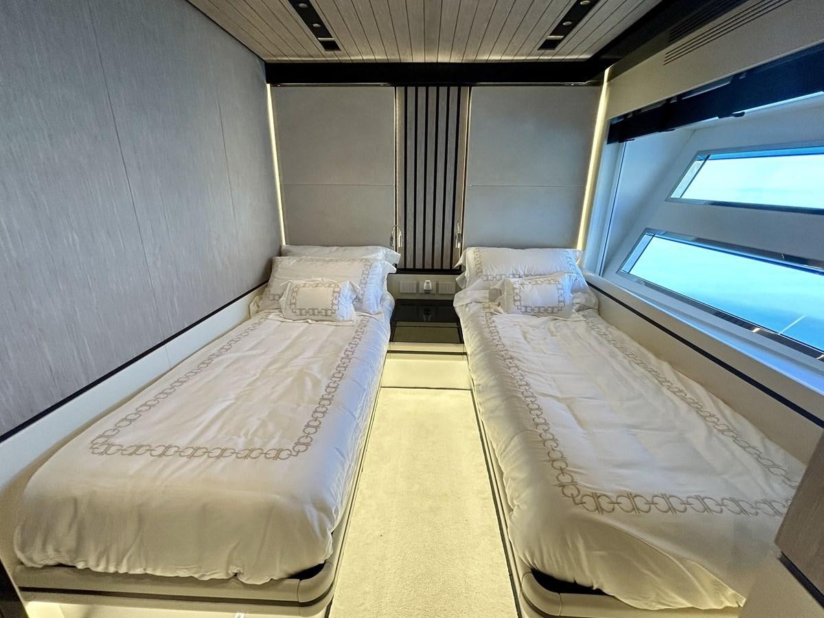 a room with beds and a tv aboard SHERPA 80 Yacht for Sale