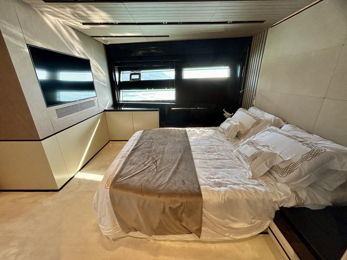 a bed with a white sheet aboard SHERPA 80 Yacht for Sale