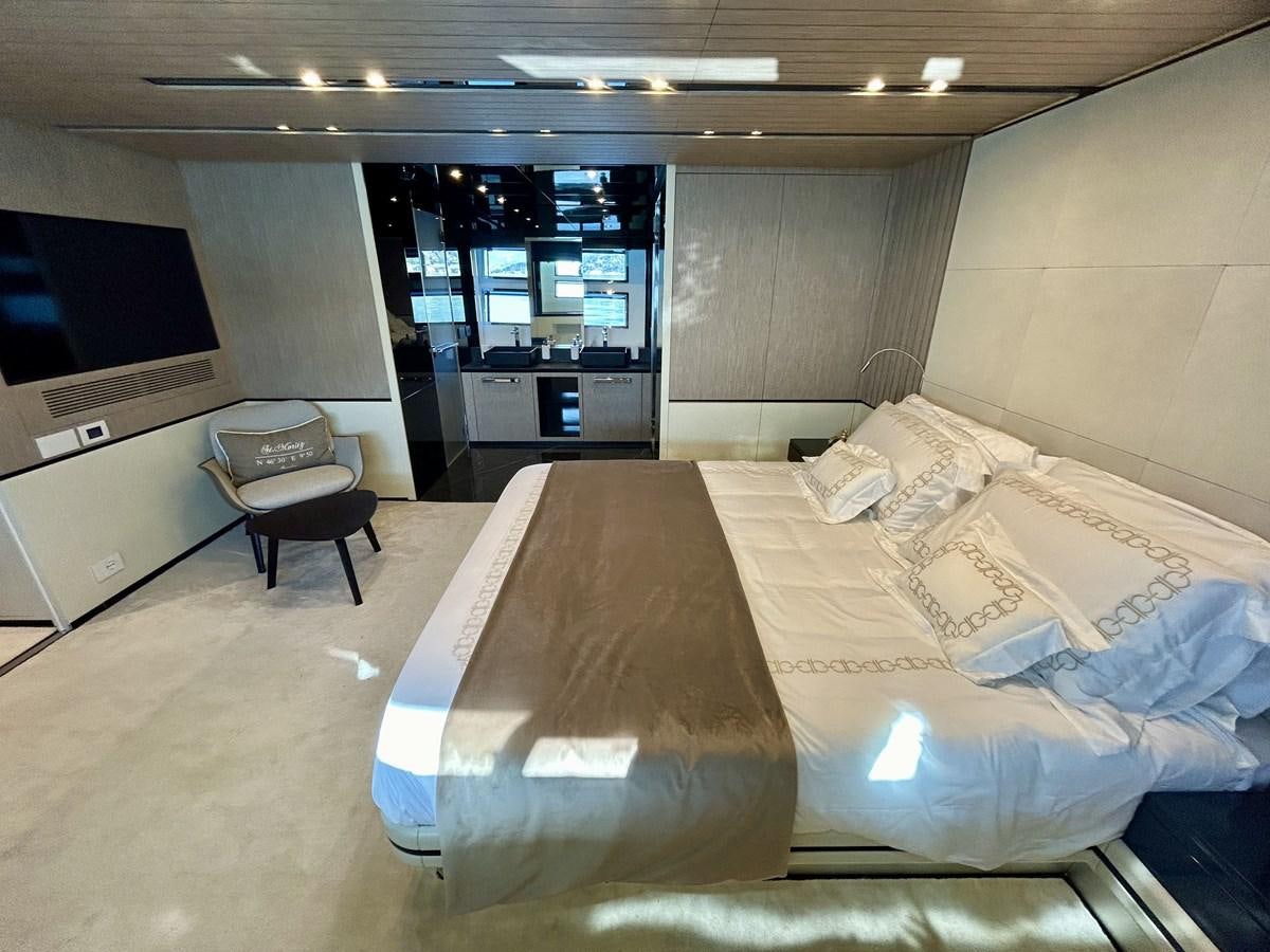 a room with a bed and a tv aboard SHERPA 80 Yacht for Sale