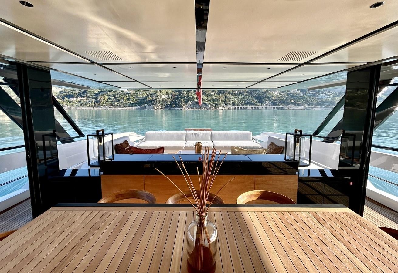 a table with a vase on it aboard SHERPA 80 Yacht for Sale