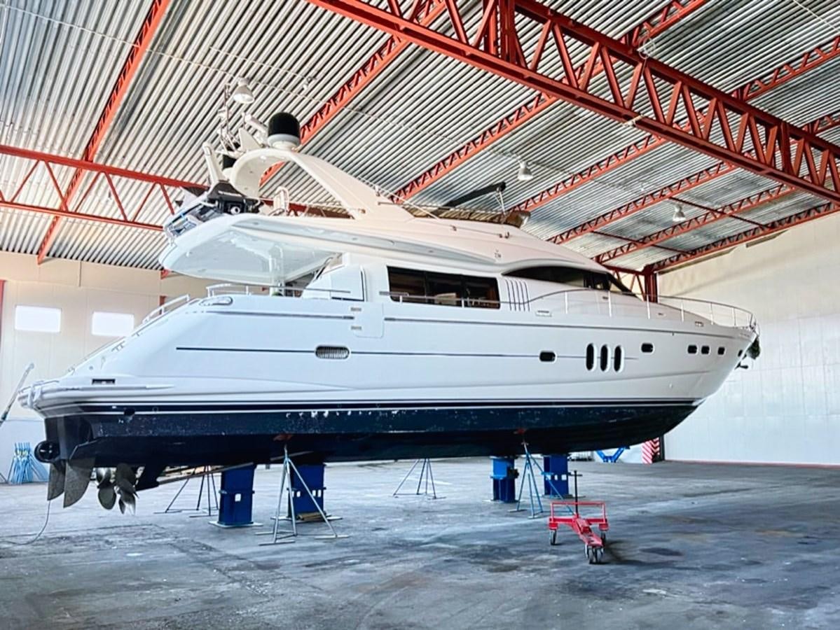 a large white boat in a large boat aboard WET ASSET Yacht for Sale