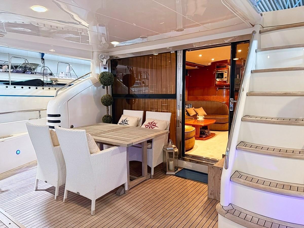 a room with a bed and a table aboard WET ASSET Yacht for Sale