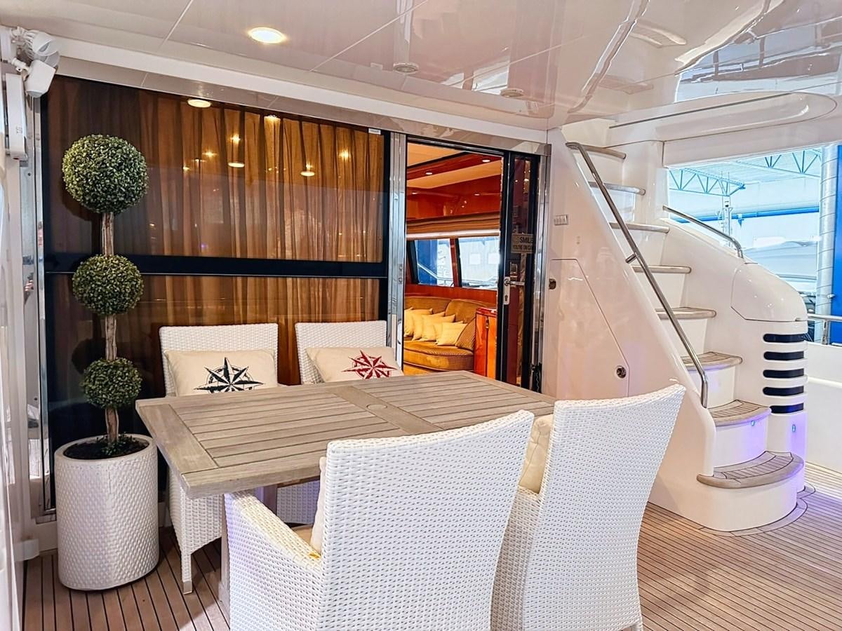 a room with a table and chairs aboard WET ASSET Yacht for Sale
