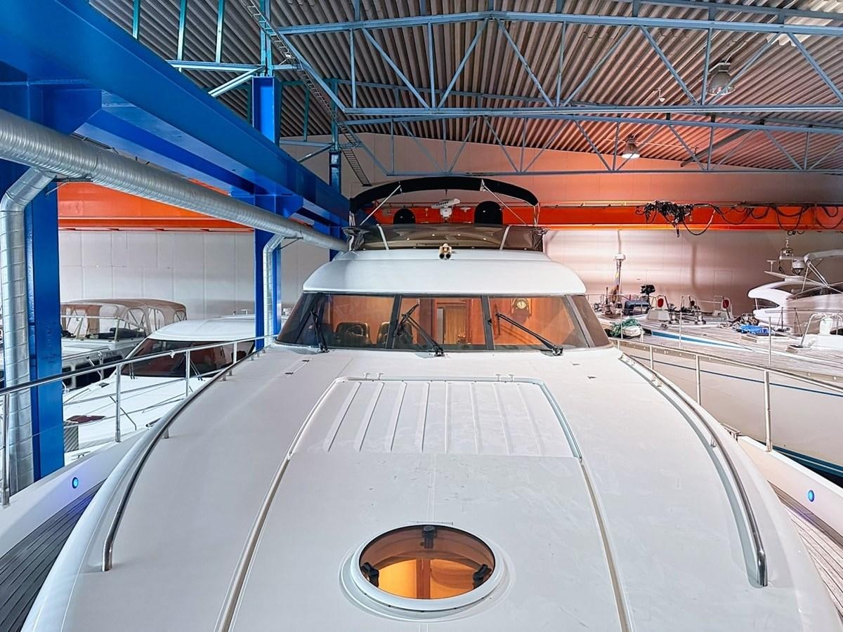 a white train in a station aboard WET ASSET Yacht for Sale