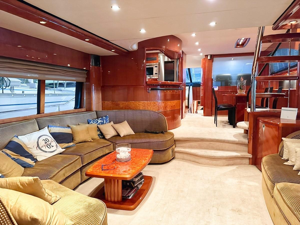 a living room with a wood wall aboard WET ASSET Yacht for Sale