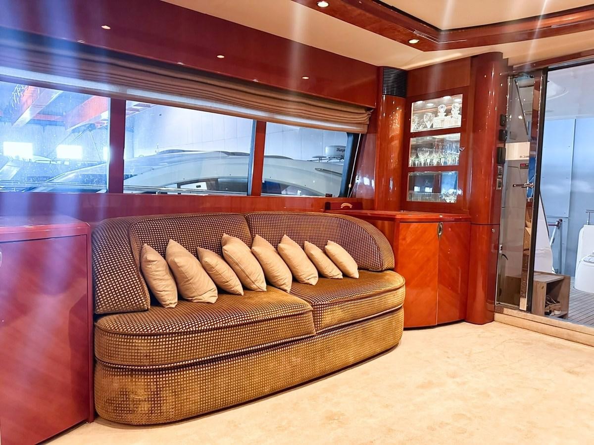 a couch in a room aboard WET ASSET Yacht for Sale