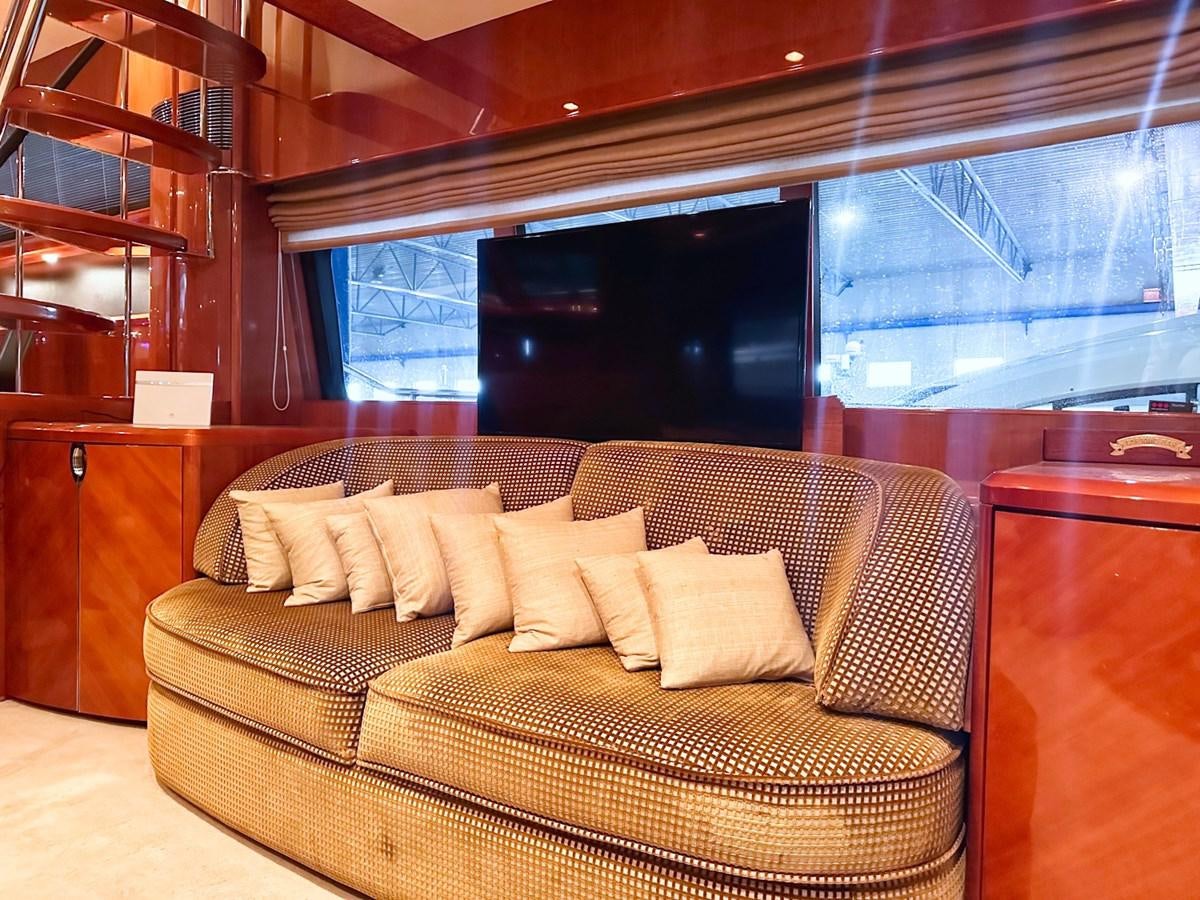 a couch in a room aboard WET ASSET Yacht for Sale