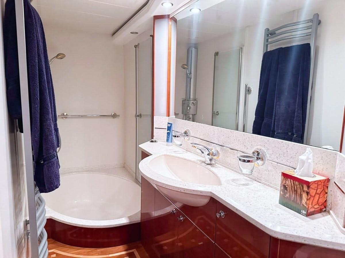 a bathroom with a large mirror aboard WET ASSET Yacht for Sale