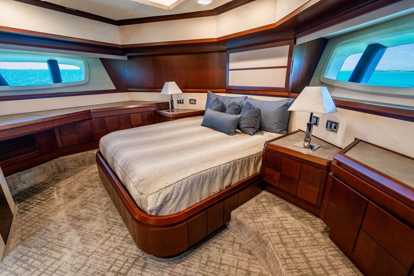 a room with a bed and a window aboard MY GIRL Yacht for Sale