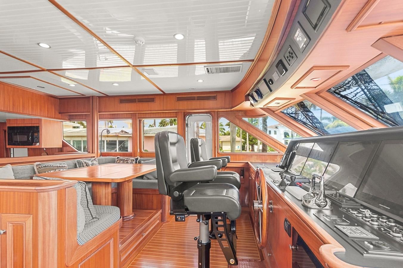 inside of a building with a bar and chairs and a table aboard SEAS TO SEE Yacht for Sale