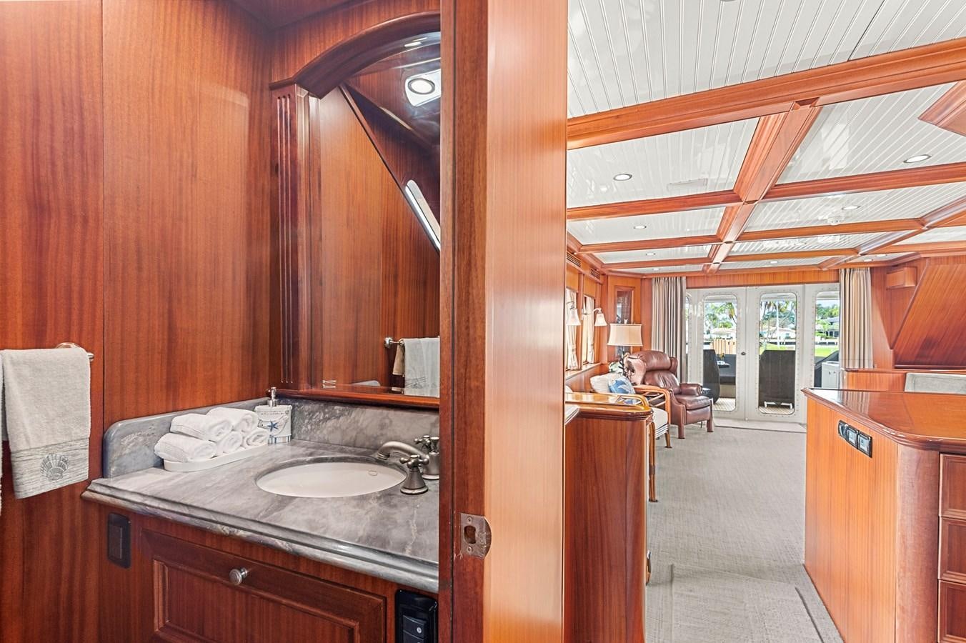a bathroom with wood walls aboard SEAS TO SEE Yacht for Sale