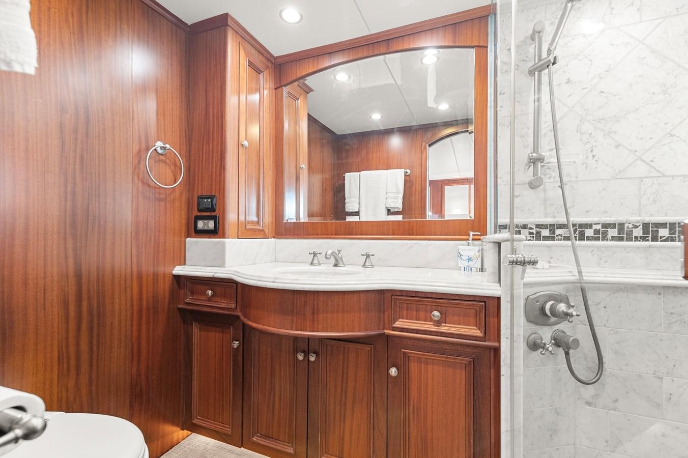 a bathroom with a mirror and a sink aboard SEAS TO SEE Yacht for Sale