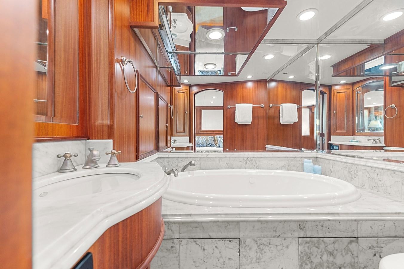 a bathroom with a bathtub and sink aboard SEAS TO SEE Yacht for Sale
