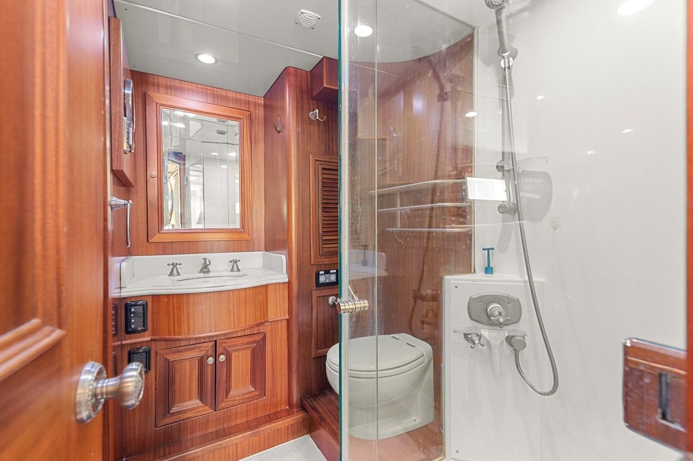 a bathroom with a toilet and a sink aboard SEAS TO SEE Yacht for Sale