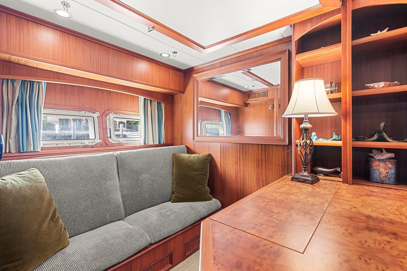 a living room with a couch and a lamp aboard SEAS TO SEE Yacht for Sale
