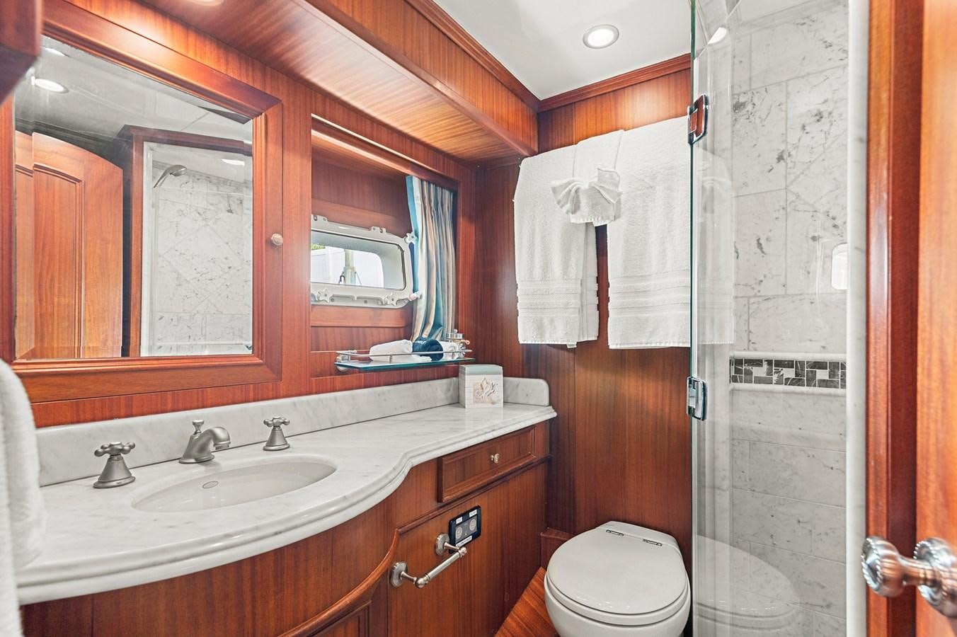 a bathroom with a sink and a toilet aboard SEAS TO SEE Yacht for Sale