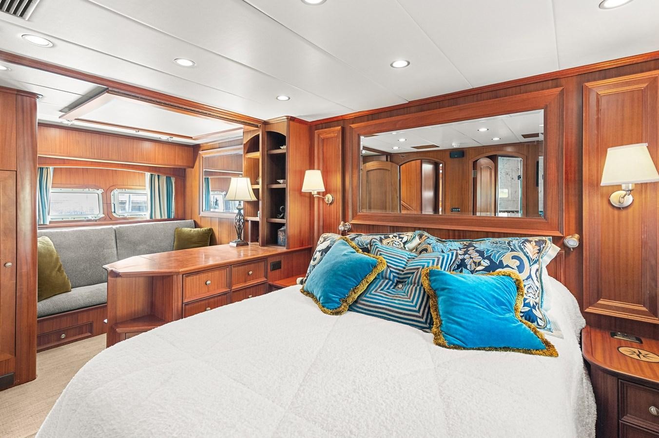 a bedroom with a bed and a couch aboard SEAS TO SEE Yacht for Sale