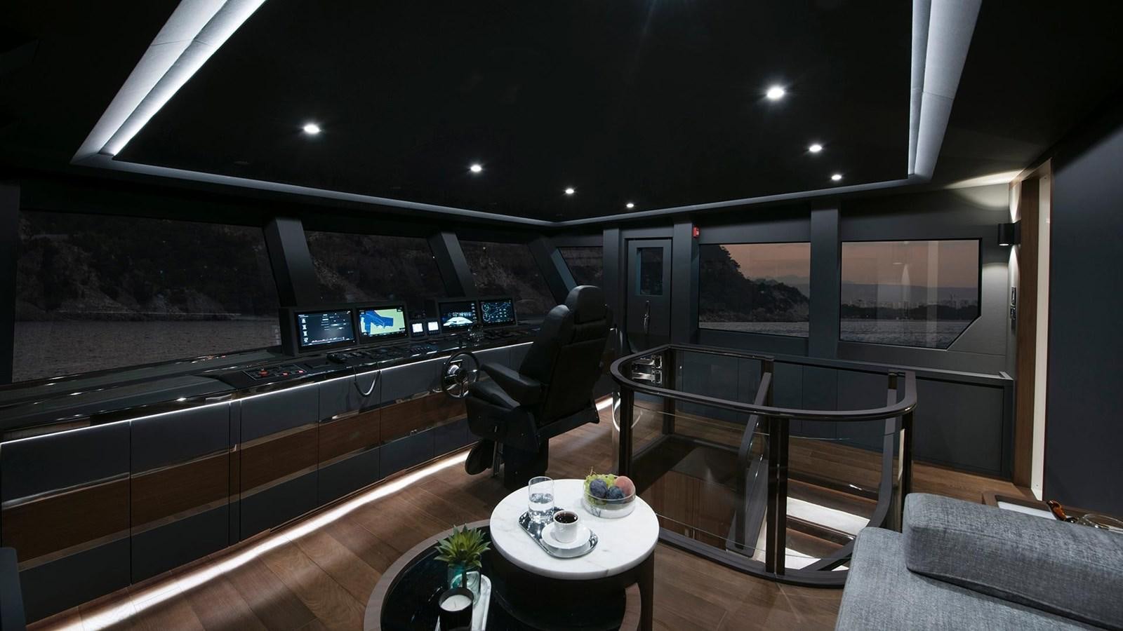 a room with a table and chairs aboard SANDRO Yacht for Sale