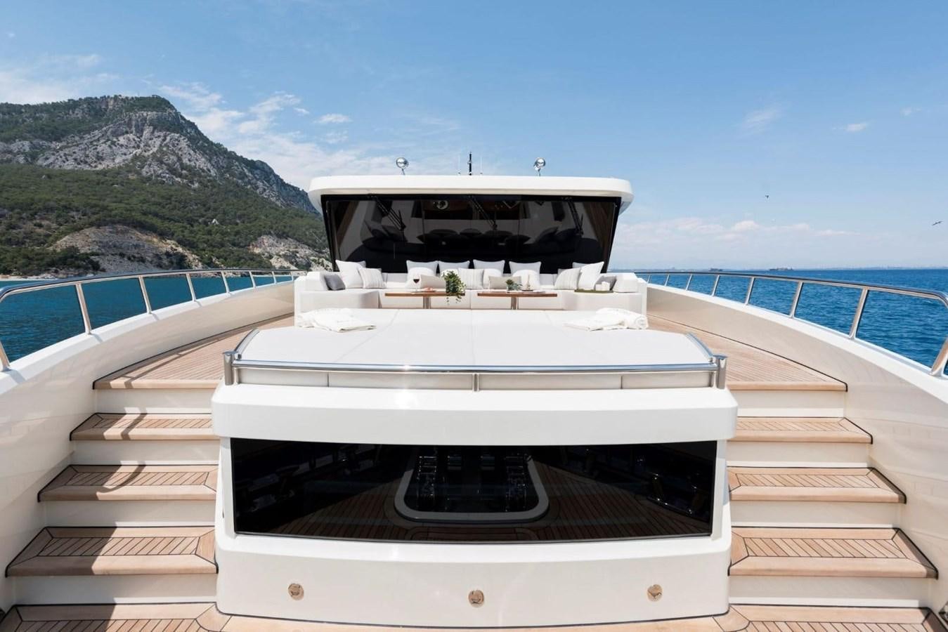 a white boat on a dock aboard SANDRO Yacht for Sale