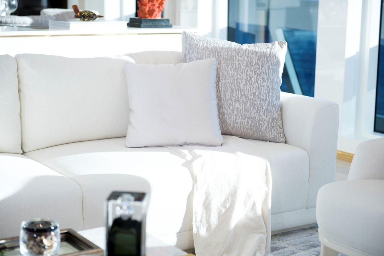 a white couch with pillows aboard SANDRO Yacht for Sale