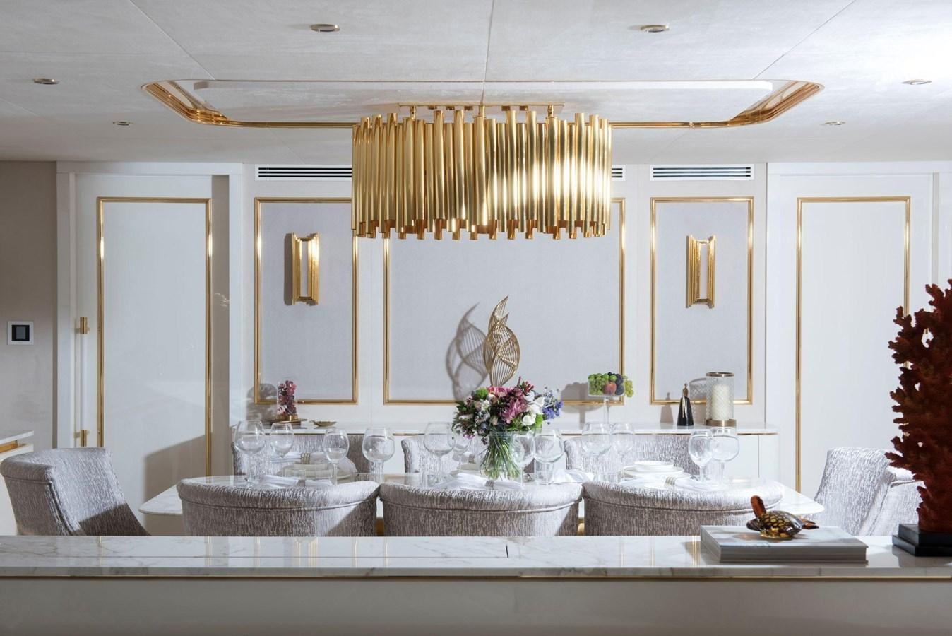 a large white kitchen with a large marble countertop aboard SANDRO Yacht for Sale