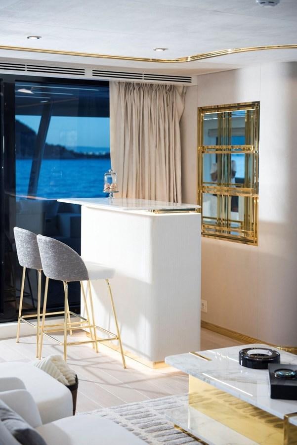 a kitchen with a table and chairs aboard SANDRO Yacht for Sale