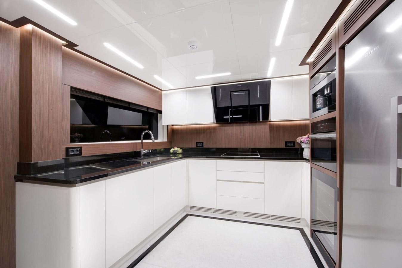 a kitchen with a microwave oven and cabinets aboard SANDRO Yacht for Sale