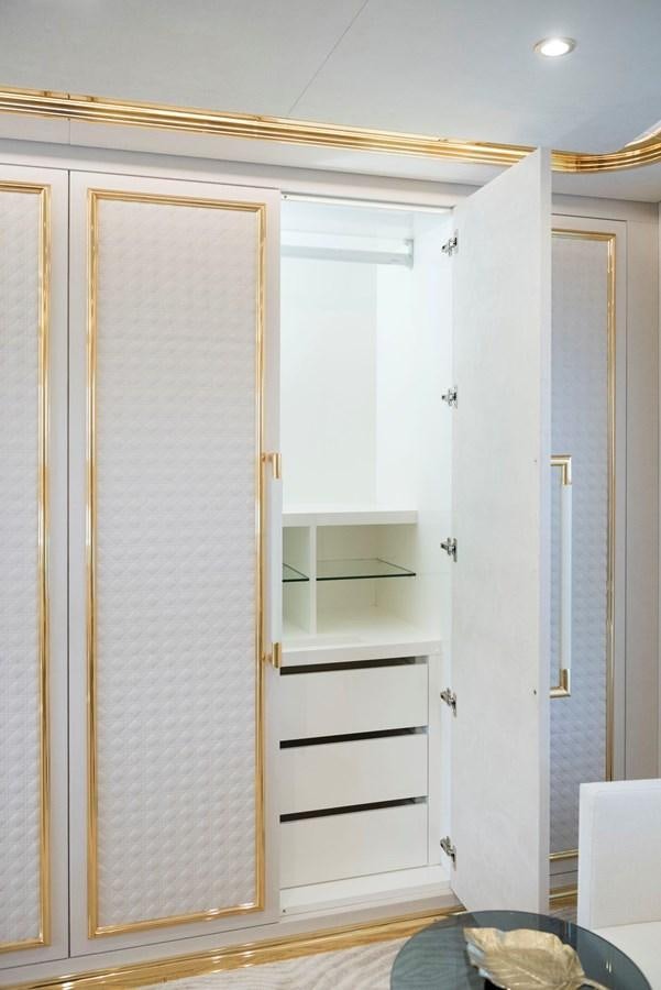 a white closet with a shelf aboard SANDRO Yacht for Sale