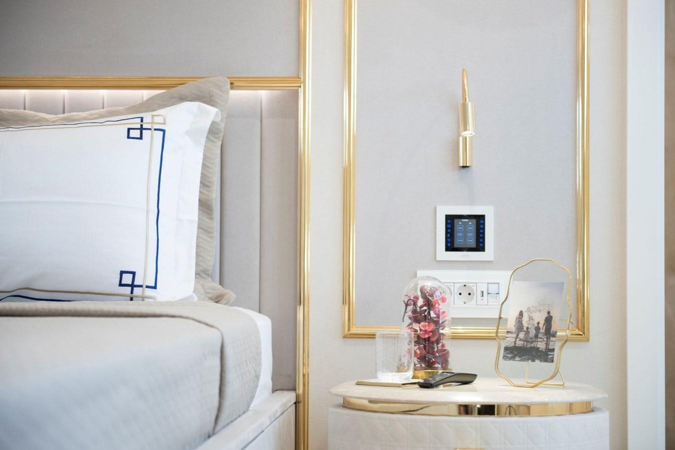 a white bedroom with a mirror aboard SANDRO Yacht for Sale
