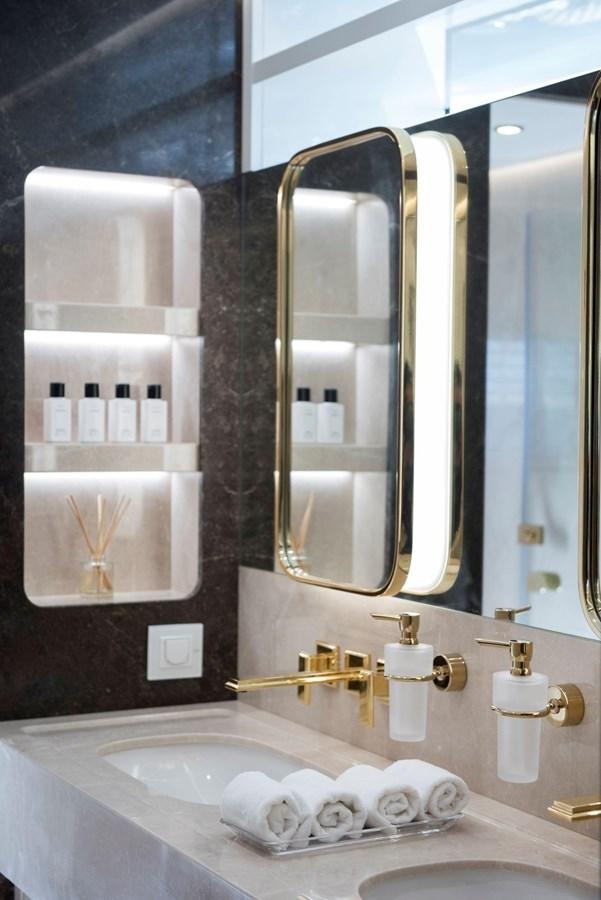 a bathroom with a large mirror aboard SANDRO Yacht for Sale