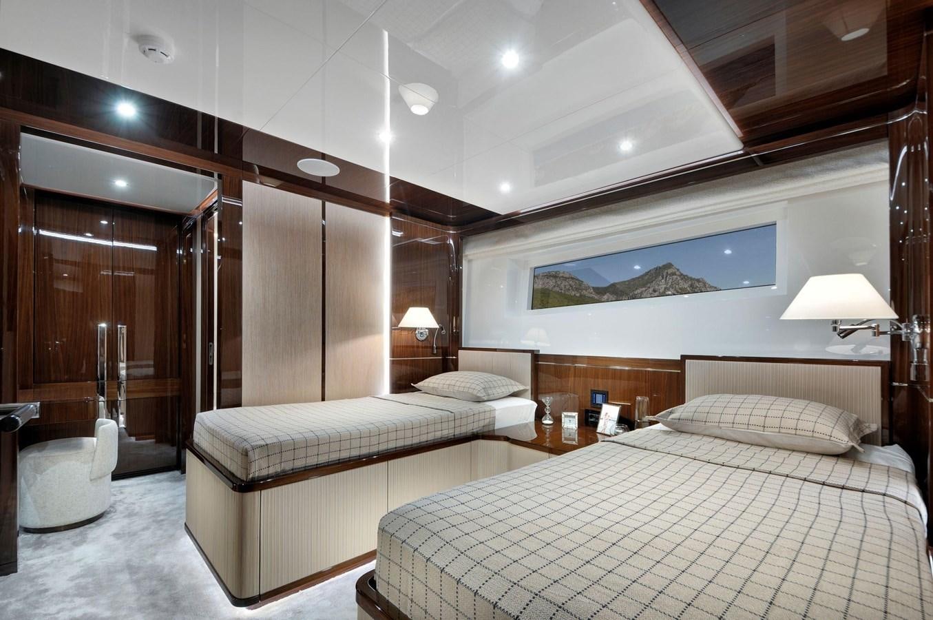 a room with a bed and a desk aboard SANDRO Yacht for Sale