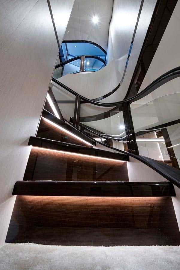 a staircase with glass windows aboard SANDRO Yacht for Sale