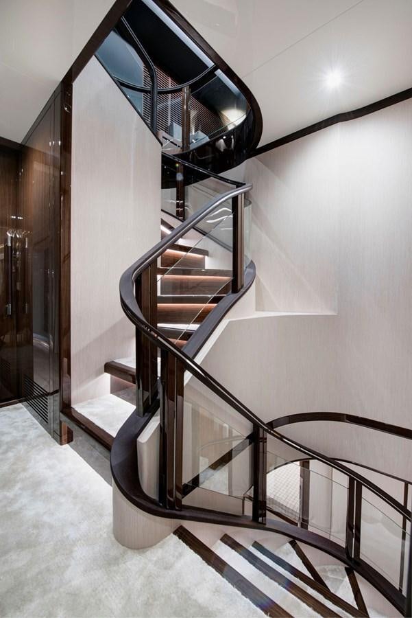 a staircase with a glass railing aboard SANDRO Yacht for Sale