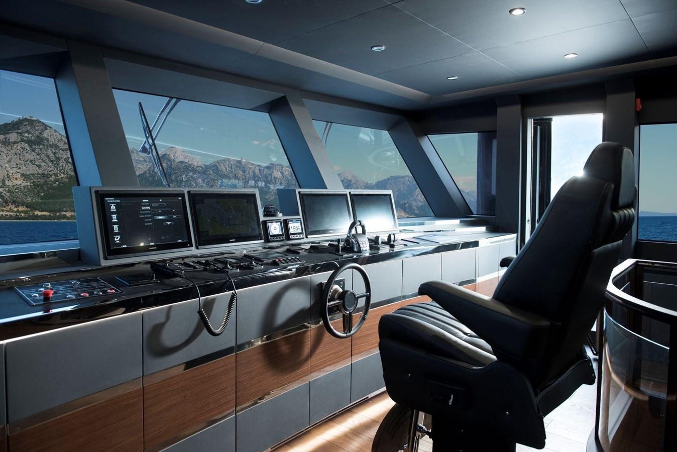 a room with many monitors and computers aboard SANDRO Yacht for Sale