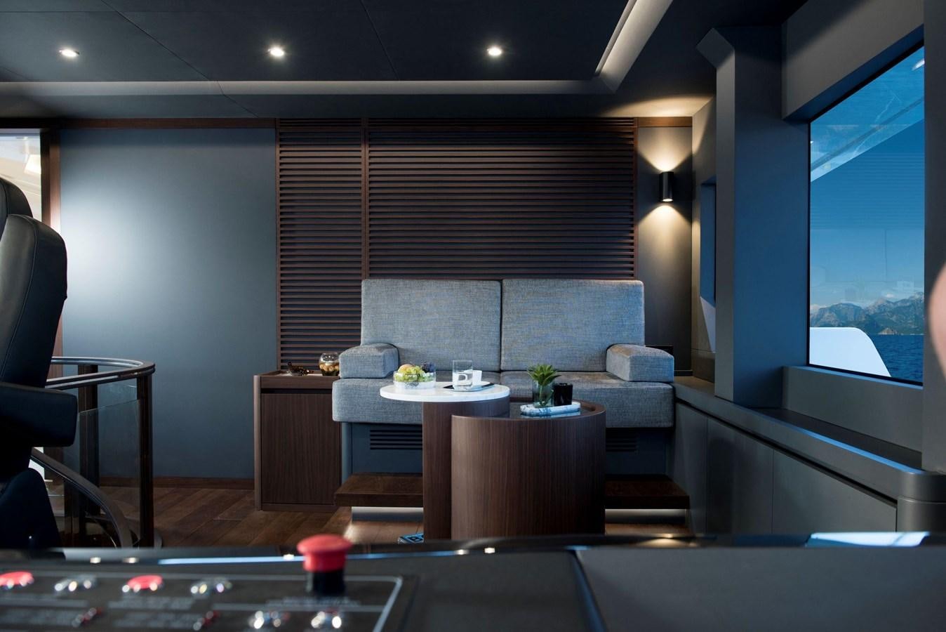 a room with a couch and a table aboard SANDRO Yacht for Sale