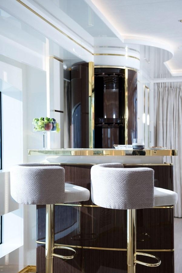 a room with a table and chairs aboard SANDRO Yacht for Sale