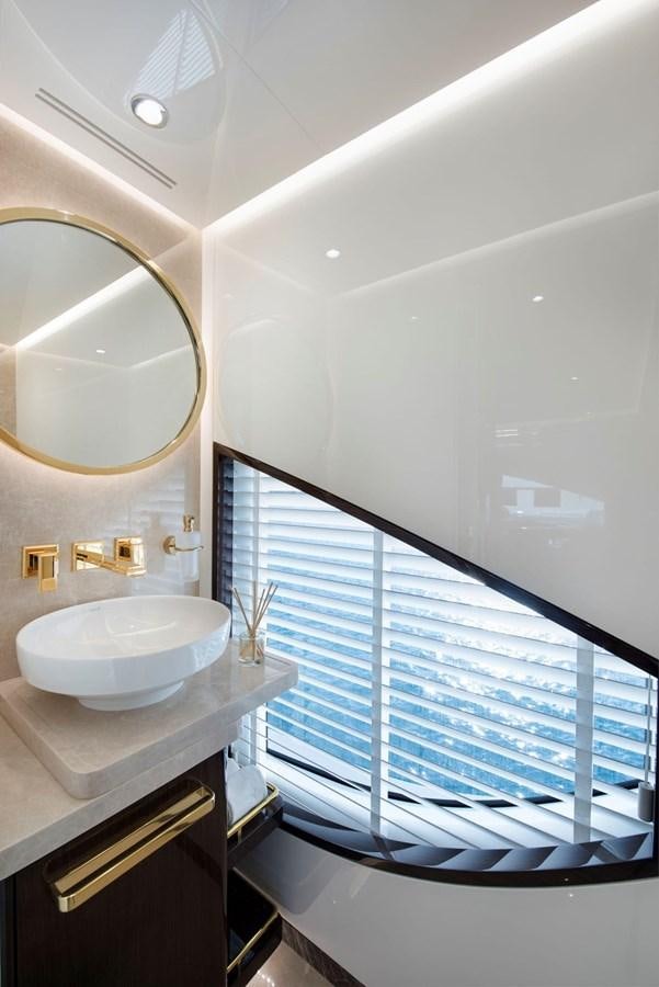 a bathroom with a sink and a mirror aboard SANDRO Yacht for Sale