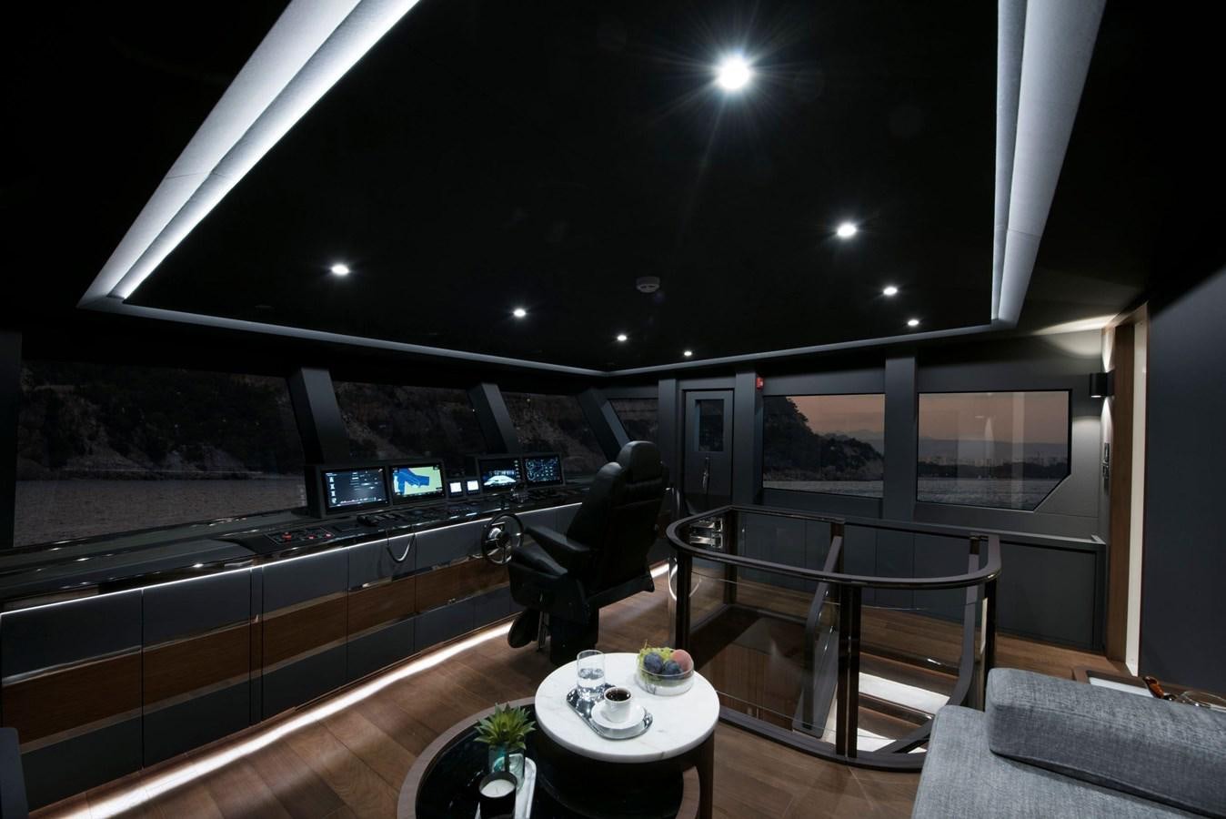 a room with a table and chairs aboard SANDRO Yacht for Sale