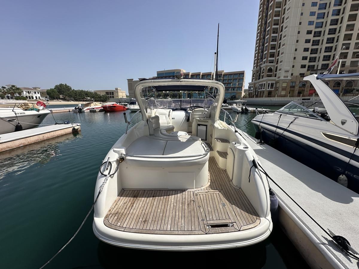 a boat docked at a pier aboard 2009 ATLANTIS 315 Yacht for Sale